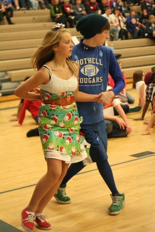 Canyon Park Junior High ninth-graders Jessica Olason and Cameron Tomisser do-si-do at today's Ho-Ho Hoedown square-dance competition. About 320 students participated in the event.