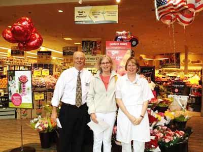 Kenmore Safeway store manager Mike Bauer recently presented a $2