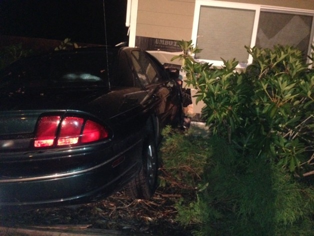 A woman crashed her car into a Kenmore home late Monday night