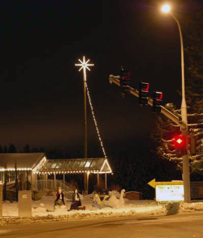 Snohomish County officials claim Park Ridge church lacks a permit for the pole that lofts the lighted star seen here high into the air in front of the Bothell church. This picture was taken two years ago after a heavy snow hit the area.