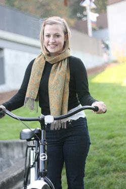 Cascadia Community College student Megan Clark shows off one of the bikes students can check out.