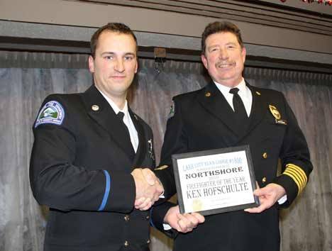 The Northshore Fire Department honored Ken Hofschulte (left) as its firefighter of the year last month at a Lake City Elks banquet. Hofschulte