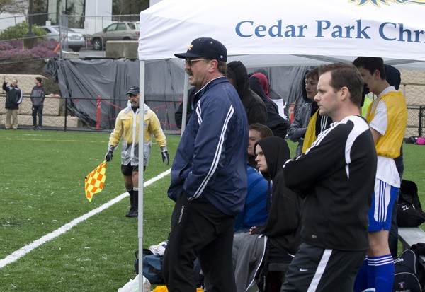 Cedar Park head coach Ken Kerr (left) watches intently as his Eagles take on Life Christian last Friday afternoon. The game was the first ever played on the school's new turf field