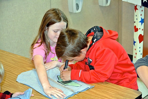 Students at Canyon Creek Elementary in Bothell cut out material for a special project.