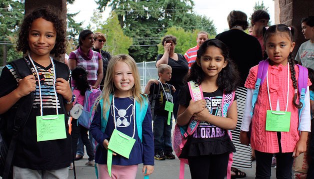 kindergarten students in Mrs. Bollinger's class smile on their first day of school.