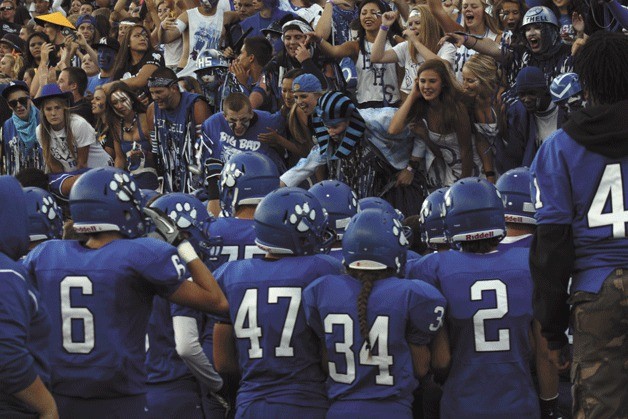 The Bothell High School football team celebrates a big win with its fans in the new Husky stadium on Saturday.