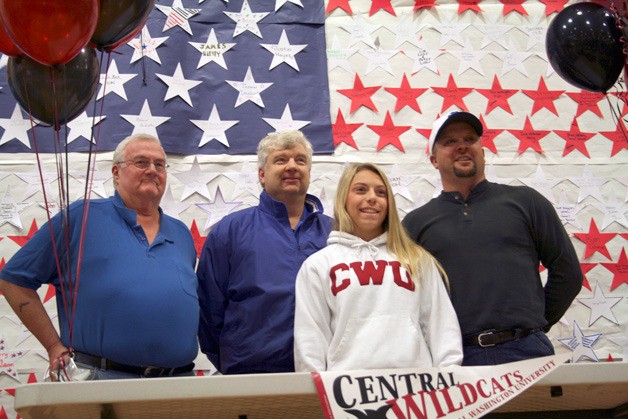 Senior Sammy Morris signed her letter-of-intent to play softball at Central Washington University early Wednesday morning at Bothell High School. She is seen here during the ceremony with