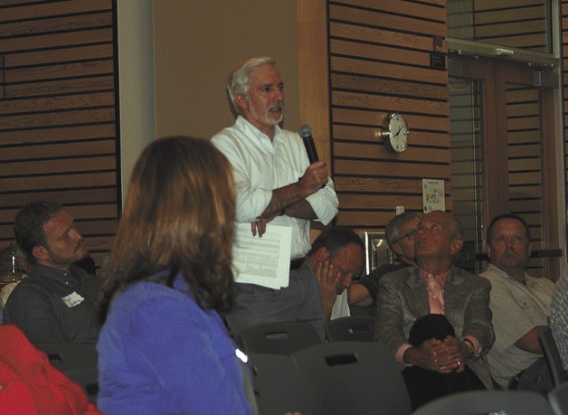 Rep. Gerry Pollet addresses a panel from the Washington State Department of Ecology and the Washington Department of Health during a town hall meeting at Kenmore City Hall on July 11.