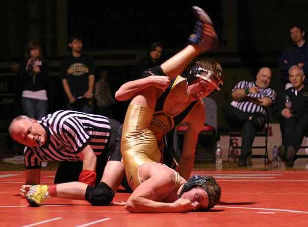 Inglemoor High standout Anthony 'Chainsaw' Bratcher puts a hold on Redmond High's Brandon Long in the 135-pound finals at the 4A Kingco Championships last Saturday at Juanita High. Bratcher shut out Long