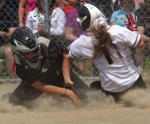 Inglemoor High's Shelby Johnston slides safely into home against Snohomish High.