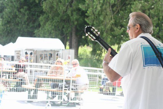 Solo jazz guitarist Bill Chism entertains the crowd on Saturday at the Bothell 2011 LiveARTS Festival. The event continues from 10 a.m. to 6 p.m. today on the Cascadia Community College/University of Washington-Bothell campus at 18345 Campus Way N.E.