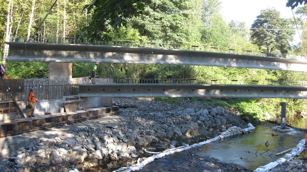 Construction crews put the girders into place for the new Swamp Creek Bridge.