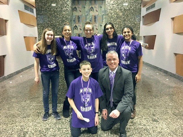 North Creek High School Principal Dr. Eric McDowell and six student Spirit Committee representatives.