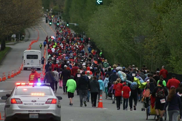 Runners and walkers fill the north-bound lanes of 120th Ave. N.E. on Saturday morning for the Can Do run in Bothell.