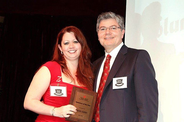 Brandi Aubrey is presented the American Heart Association Volunteer of the Year Award by Chairperson-elect Stephen Zieniewicz.