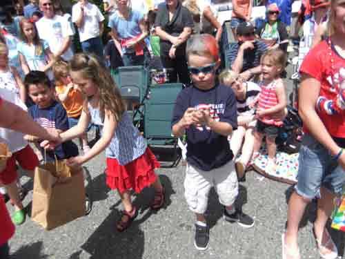 Kids grab candy during last week's downtown Bothell Fourth of July grand parade