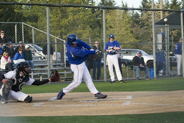 Bothell senior Sam Lee blasts a two-run home run in the third inning during the Cougars' 4-3 extra-innings win over rival Inglemoor. Lee had a night