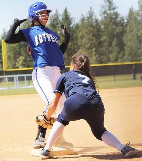 Bothell High's Kendra Heyer rolls into third base against Bellarmine Prep.