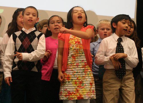 Woodin Elementary third-grade dual-language students sing 'Giving and Receiving' and 'En La Vida' at today's Northshore Schools Foundation 'Light a Fire for Learning' eighth annual benefit luncheon at the Lynnwood Convention Center.