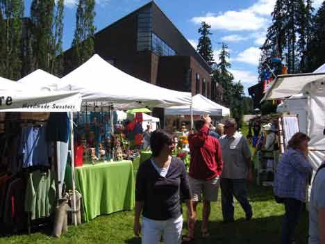 Art enthusiasts peruse items at last year's Bothell LiveARTS Festival.