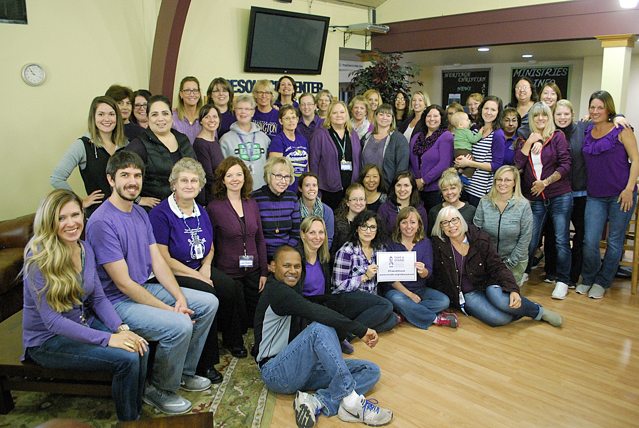 The staff at the Heritage Christian Academy in Bothell showed support for survivors of domestic violence on Thursday