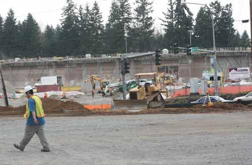 Construction workers in action: A view from Mike Nelson’s home across Bothell Everett Highway.