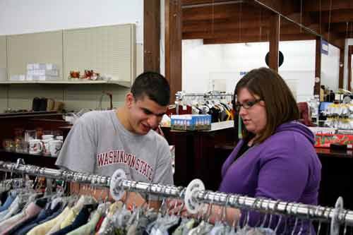 Bo Daane gathers empty clothes hangers in the St. Vincent DePaul Thrift Store with the help of behavioral specialist Kelsey McDonald. Daane is part of the Northshore School District’s Adult Transition Program.