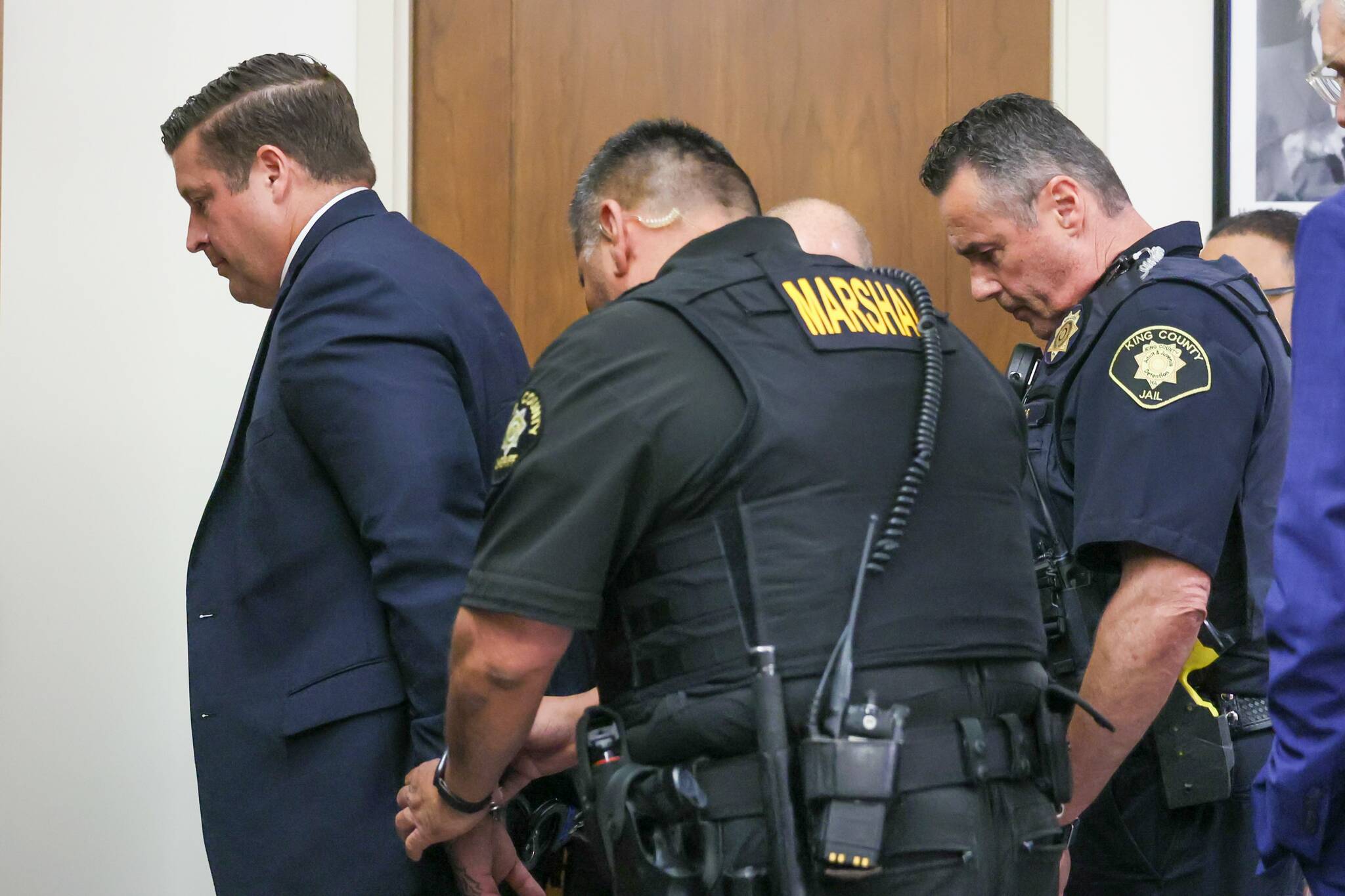 Auburn Police Officer Jeffrey Nelson is escorted out of the courtroom following the guilty verdict at his murder trial June 27, 2024. (Ken Lambert / The Seattle Times / Pool)