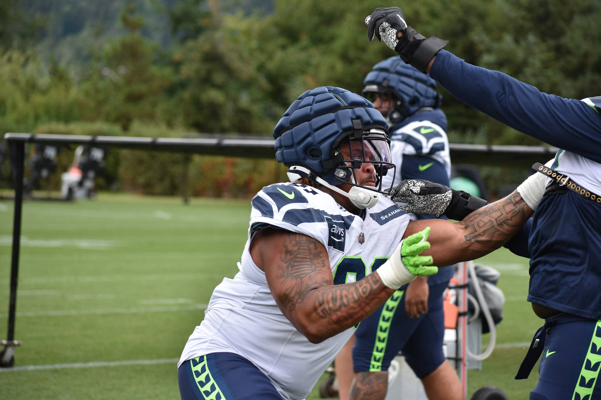 Byron Murphy II gets going during a defensive line drill. Ben Ray / Sound Publishing