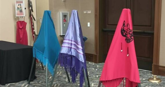 The Lummi Nation provided three colorful shawls during the MMIWP Task Force Summit in September, with turquoise representing human trafficking, purple representing overdoses (“losing our people from fentanyl”) and red representing murdered and missing Indigenous women — all crises that affect North American Natives and Tribes. The summit started with an opening ceremony with words from Lummi Tribal Chair Anthony Hillaire, Lummi Indian Business Council Secretary Lisa Wilson and a Shawl Ceremony with Lhaq’temish singers. Photo by Bailey Jo Josie/Sound Publishing